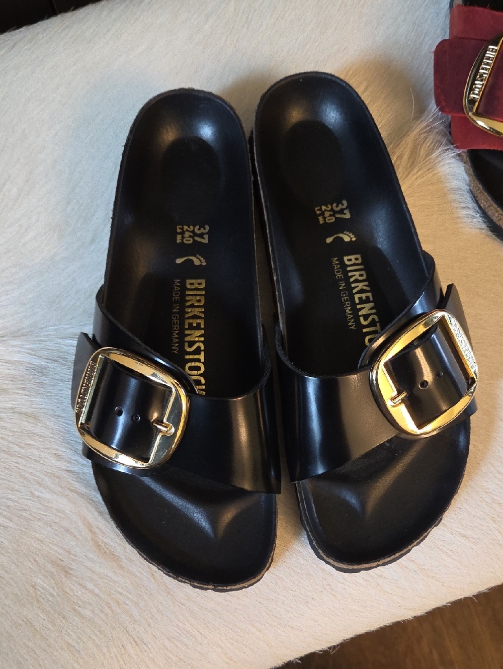 Birkenstock Black Single-Band Slides with Gold Buckle